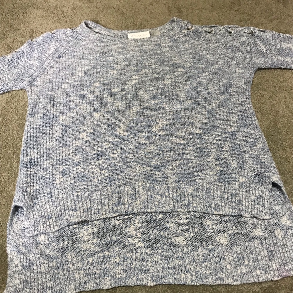heather blue sweater. lacing on shoulders.
